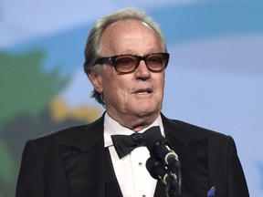 FILE - In this Jan. 2, 2018 file photo, Peter Fonda presents the Desert Palm achievement award at the 29th annual Palm Springs International Film Festival in Palm Springs, Calif. Fonda has apologized for a late-night Twitter rant that said 12-year-old Barron Trump should be ripped from "his mother's arms and put in a cage with pedophiles." The all-capitals tweet early Wednesday went on to call President Donald Trump an expletive. Fonda later deleted the tweet and drew sharp rebukes from first lady Melania Trump and Donald Trump Jr.