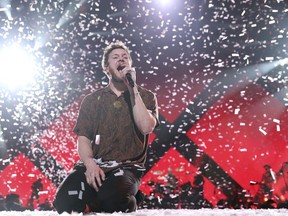 FILE - In this Feb. 1, 2018 file photo, Dan Reynolds, lead singer of Imagine Dragons, performs at the EA Sports Bowl in Minneapolis. The band kicked off the second leg of its Evolve World Tour this week.