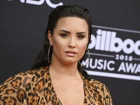 FILE - In this May 20, 2018 file photo, Demi Lovato arrives at the Billboard Music Awards in Las Vegas. Lovato celebrated six years of sobriety in March, but she's revealed in a new song that she's no longer sober. The pop star released "Sober" on YouTube on Thursday, June 21.