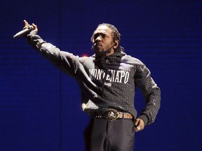 FILE - In this Feb. 21, 2018 file photo, Kendrick Lamar performs at the Brit Awards 2018 in London. Lamar, Lil Wayne and Meek Mill helped the famed Summer Jam music event celebrate its 25th anniversary with jam-packed performances. Remy Ma, Tory Lanez and BBD also worked the stage Sunday for the feverish audience at the MetLife Stadium in East Rutherford, New Jersey.
