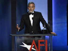 FILE - In this June 7, 2018 file photo, actor-director George Clooney accepts the 46th AFI Life Achievement Award in Los Angeles. The American Film Institute hosted a star-studded gala earlier this month to honor the Oscar-winner's achievements as an actor, director and activist. TNT is airing the gala on Thursday at 10 p.m. Eastern and Pacific.