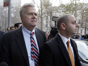 FILE - In this Dec. 11, 2015, file photo, former New York state Senate leader Dean Skelos, left, and his son Adam Skelos leave federal court, in New York. A retrial is set to begin for ex-New York Senate leader Dean Skelos and his son on corruption charges. Jury selection is scheduled to get underway on Tuesday, June 19, 2018, in Manhattan.