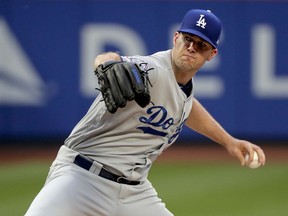 Los Angeles Dodgers pitcher Alex Wood delivers against the New York Mets during the first inning of a baseball game, Friday, June 22, 2018, in New York.