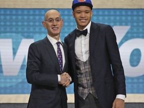 Kentucky's Kevin Knox, right, poses with NBA Commissioner Adam Silver after he was picked ninth overall by the New York Knicks during the NBA basketball draft in New York, Thursday, June 21, 2018.