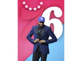 Villanova's Mikal Bridges leaves the stage after he was picked 10th overall by the Philadelphia 76ers during the NBA basketball draft in New York, Thursday, June 21, 2018.