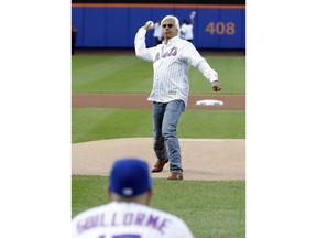 Bob Baffert, the trainer for Justify, throws out the ceremonial first pitch at a baseball game between the New York Mets and the Baltimore Orioles on Tuesday, June 5, 2018, in New York.