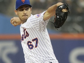 New York Mets' Seth Lugo delivers a pitch during the first inning of the team's baseball game against the Chicago Cubs on Thursday, May 31, 2018, in New York.