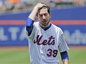 New York Mets pitcher Jerry Blevins leaves the field after the top of the first inning of a baseball game against the Los Angeles Dodgers at Citi Field, Sunday, June 24, 2018, in New York.