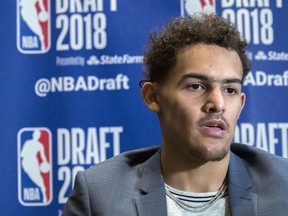 Oklahoma's Trae Young speaks to reporters during a media availability with the top basketball prospects in the NBA Draft, Wednesday, June 20, 2018, in New York.