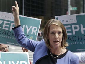 Zephyr Teachout points to Trump Tower while announcing her Democratic Party candidacy for the New York State Attorney General, Tuesday, June 5, 2018, in New York. Teachout faces several candidates in the attorney general race, including New York City Public Advocate Letitia James. James won the endorsement of state Democrats at their convention last month.