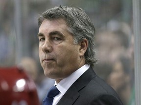 FILE - In this March 31, 2016 file photo Arizona Coyotes head coach Dave Tippett looks on from the bench during the first period of an NHL hockey game against the Dallas Stars in Dallas. Tippett has signed on as senior advisor for the group looking to bring an NHL franchise to Seattle. The longtime NHL coach confirmed the move to The Associated Press on Monday, June 18, 2018 after it was first reported by the Seattle Times. Tippett is already working for Seattle Hockey Partners LLC under President and chief operating officer Tod Leiweke.