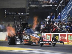 In this photo provided by the NHRA, Clay Millican picked up his second straight victory in Top Fuel on Sunday, June 3, 2018 with a win at the JEGS Route 66 NHRA Nationals at Route 66 Raceway.