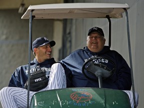 FILE - In this Feb. 19, 2010 file photo New York Yankees pitcher Andy Pettitte, left, laughs with Billy Connors, the Yankees vice president for player personnel, before pitchers and catchers worked out at Steinbrenner Field in Tampa, Fla. Connors, a three-time Yankees pitching coach and confidant of late owner George Steinbrenner, has died. He was 76. The Yankees said Wednesday, June 20, 2018 that Connors died Monday.