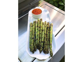 This June 16, 2018 photo shows Grilled Asparagus with Romesco Sauce from a recipe by Elizabeth Karmel in Amagansett, N.Y.