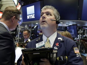 Trader John Panin works on the floor of the New York Stock Exchange, Tuesday, June 19, 2018. U.S. stock markets are opening sharply lower Tuesday as tensions over trade between the U.S. and China seem closer to a boil.