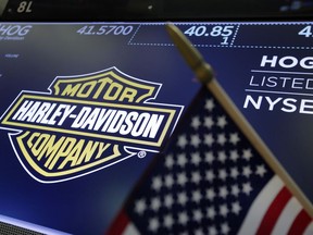 The logo for Harley-Davidson appears above a trading post on the floor of the New York Stock Exchange, Tuesday, June 26, 2018. President Donald Trump denied Tuesday that his trade policy is to blame for Harley-Davidson's decision to shift some motorcycle production overseas, saying on Twitter that the company is using "Tariffs/Trade War as an excuse" to hide previously announced plans to move jobs to Asia.