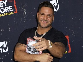FILE - In this Thursday, March 29, 2018, file photo, Ronnie Ortiz-Magro arrives at the LA Premiere of "Jersey Shore Family Vacation" in Los Angeles. Police and her lawyer said Monday, June 25, 2018, that the 31-year-old ex-girlfriend of "Jersey Shore" TV show star Ronnie Ortiz-Magro is facing a misdemeanor domestic battery charge in Las Vegas after a weekend fight.