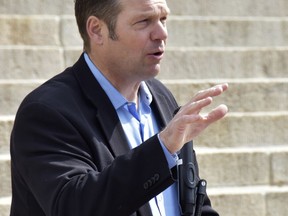 FILE - In this Friday, April 20, 2018, file photo, Kansas Secretary of State Kris Kobach speaks during a rally at the Statehouse in Topeka, Kan. A federal judge has ruled Kansas cannot require documentary proof of U.S. citizenship to register to vote, a setback for Kobach in a case with national implications for voting rights.
