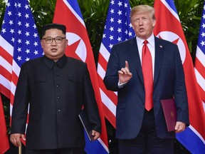 FILE - In this June 12, 2018, file photo, U.S. President Donald Trump makes a statement before saying goodbye to North Korea leader Kim Jong Un after their meetings at the Capella resort on Sentosa Island in Singapore. On Thursday, June 21, 2018, the Trump administration identified the missile test engine site that it says North Korea has pledged to destroy, but the president's latest comments about resolving the nuclear standoff have raised new questions about what concessions Pyongyang has made.