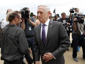 FILE - In this Wednesday, June 20, 2018, file photo, U.S. Defense Secretary Jim Mattis steps away after speaking with the media at the Pentagon, in Washington. Speaking to reporters on his plane en route to a stop in Alaska, Sunday, June 24, Mattis laid out plans for a less contentious, more open dialogue with Chinese leaders as he travels to Asia, less than a month after he slammed Beijing at an international conference for its militarization of islands in the South China Sea.