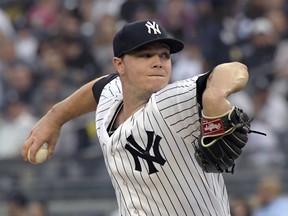 New York Yankees starting pitcher Sonny Gray winds up during the first inning of the team's baseball game against the Washington Nationals on Wednesday, June 13, 2018, at Yankee Stadium in New York.