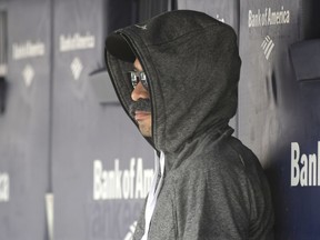 Ichiro Suzuki, special assistant to the chairman of the Seattle Mariners, wears a fake mustache and a hoodie as he sits in the dugout and watches the New York Yankees bat during the first inning of a baseball game Thursday, June 21, 2018, at Yankee Stadium in New York. Suzuki donned a Bobby Valentine-style disguise and sneaked into the Seattle dugout to watch a bit of the action at Yankee Stadium.