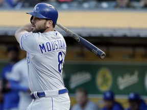 Kansas City Royals' Mike Moustakas watches a double during the first inning of the team's baseball game against the Oakland Athletics on Thursday, June 7, 2018, in Oakland, Calif.
