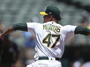 Oakland Athletics pitcher Frankie Montas works against the Houston Astros in the first inning of a baseball game Thursday, June 14, 2018, in Oakland, Calif.