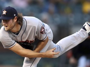 Houston Astros pitcher Gerrit Cole follows through on a delivery to an Oakland Athletics batter during the first inning of a baseball game Wednesday, June 13, 2018, in Oakland, Calif.