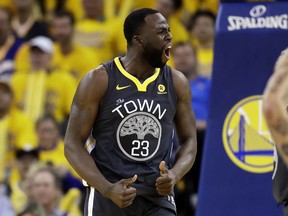 Golden State Warriors forward Draymond Green (23) reacts during the first half of Game 2 of basketball's NBA Finals between the Warriors and the Cleveland Cavaliers in Oakland, Calif., Sunday, June 3, 2018.