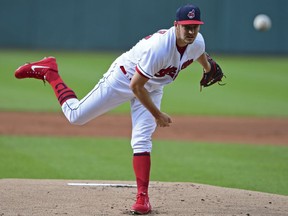Cleveland Indians starting pitcher Trevor Bauer delivers in the first inning of a baseball game against the Detroit Tigers, Saturday, June 23, 2018, in Cleveland.