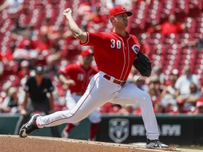 Cincinnati Reds starting pitcher Tyler Mahle throws in the first inning of a baseball game against the Colorado Rockies, Thursday, June 7, 2018, in Cincinnati.