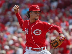 Cincinnati Reds starting pitcher Luis Castillo throws in the first inning of a baseball game against the St. Louis Cardinals, Saturday, June 9, 2018, in Cincinnati.