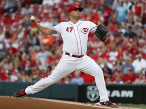 Cincinnati Reds starting pitcher Sal Romano throws during the first inning of the team's baseball game against the Detroit Tigers, Tuesday, June 19, 2018, in Cincinnati.