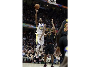 Golden State Warriors' Kevin Durant shoots over Cleveland Cavaliers' Rodney Hood in the first half of Game 4 of basketball's NBA Finals, Friday, June 8, 2018, in Cleveland.