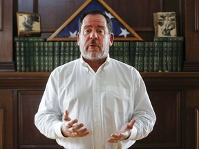 FILE – In this Feb. 3, 2018, file photo, Ross Geiger speaks as he poses for a photograph at his home in the Cincinnati suburb of Loveland, Ohio. Ohio Parole Board members, who voted 11-1 in 2017 against sparing death row inmate Raymond Tibbetts, scheduled a rare second clemency hearing Thursday, June 14, 2018, to hear directly from Geiger, a juror who recommended Tibbetts be sentenced to death but now says jurors weren't given enough information about the convicted killer's tough childhood. Tibbetts is currently set to be executed by lethal injection on Oct. 17, 2018, after Republican Ohio Gov. John Kasich granted Tibbetts a temporary reprieve on Feb. 8, 2018.