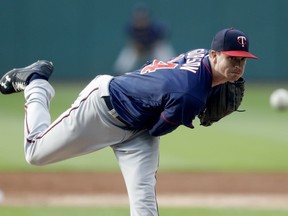 Minnesota Twins starting pitcher Kyle Gibson delivers during the first inning of a baseball game against the against the Cleveland Indians, Friday, June 15, 2018, in Cleveland.