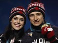 Figure skating gold medallists Tessa Virtue and Scott Moir pose during the medals ceremony at the 2018 Winter Olympics in Pyeongchang, South Korea, on Feb. 20, 2018.