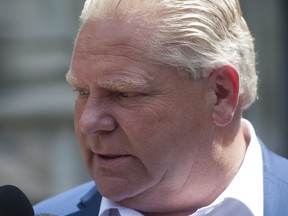 Ontario Premier-designate Doug Ford speaks to reporters before heading into Whitney Block for a meeting with his transition team in Toronto, Sunday, June 10, 2018.