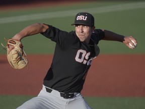 Oregon State starter Luke Heimlich pitches to an LSU batter during an NCAA college baseball tournament regional game in Corvallis, Ore., Saturday, June 2, 2018.