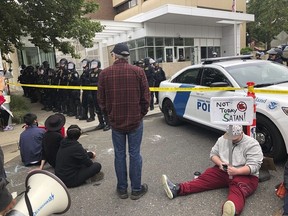 Protesters set up camp around U.S. Immigration and Customs Enforcement building, Thursday, June 28, 2018 in Portland, Ore. Federal officers arrested eight protesters while trying to reopen the building, that has been closed for more than a week because of a round-the-clock demonstration.