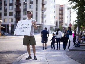 In this June 17, 2018, file photo, a round-the-clock vigil is underway ICE headquarters in Portland, Ore. A rights group has filed an emergency suit in federal court against top officials of U.S. immigration and homeland security departments, alleging they have unconstitutionally denied lawyers' access to immigrants being held in a federal prison in Oregon.