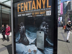 An anti-fentanyl advertisment is seen on a sidewalk in downtown Vancouver, Tuesday, April, 11, 2017. New government figures show that nearly 4,000 Canadians died from apparent opioid overdoses last year, with men the most likely victims and fentanyl the clear culprit.