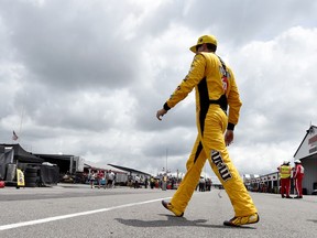 Kyle Busch walks through the garage area after practice for Sunday's NASCAR Cup Series Pocono 400 auto race, Friday, June 1, 2018, in Long Pond, Pa.