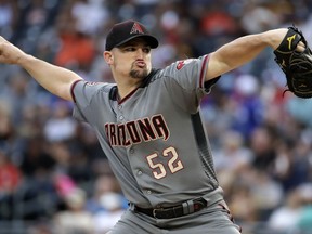 Arizona Diamondbacks starting pitcher Zack Godley delivers in the first inning of the team's baseball game against the Pittsburgh Pirates in Pittsburgh, Thursday, June 21, 2018.