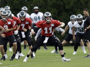 Philadelphia Eagles' Carson Wentz (11) warms up during an organized team activity at the NFL football team's facility, Wednesday, June 6, 2018, in Philadelphia.