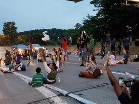 People protesting the East Pittsburgh police after the June 19 shooting death of Antwon Rose shut down Interstate 376  in Pittsburgh on Thursday, June 21, 2018. Rose, a 17-year-old boy fatally shot by a police officer in Pennsylvania seconds after he fled a traffic stop, did not pose a threat to anyone, a lawyer for the family of the teen said.