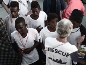 This undated photo released on Tuesday, June 12, 2018, by French NGO "SOS Mediterranee" and posted on it's Twitter account, shows stranded migrants aboard SOS Mediterranee's Aquarius ship and MSF (Doctors Without Borders) NGOs, in the Mediterranean Sea. Italy's new "Italians first" government claimed victory Monday when the Spanish prime minister offered safe harbor to a private rescue ship after Italy and Malta refused to allow it permission to disembark its 629 migrant passengers in their ports.