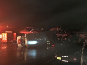 Vehicles damaged from a powerful storm are seen outside a U-Haul in Wilkes-Barre Township, Pa., Wednesday, June 13, 2018. A strong storm has pounded parts of Pennsylvania, damaging buildings, overturning cars and downing trees and power lines. The storm struck a shopping plaza in Wilkes-Barre Township Wednesday night.