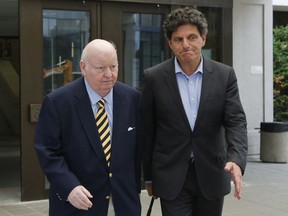 Senator Mike Duffy, left, leaves the Ottawa courthouse with his lawyer, Lawrence Greenspon, on Wednesday, June 27, 2018.
